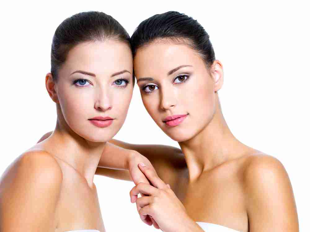 ovals portrait-two-beautiful-young-women-isolated-white