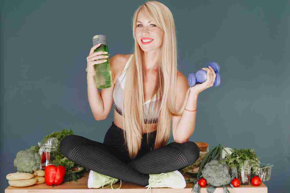 Woman with great hair with weights and food